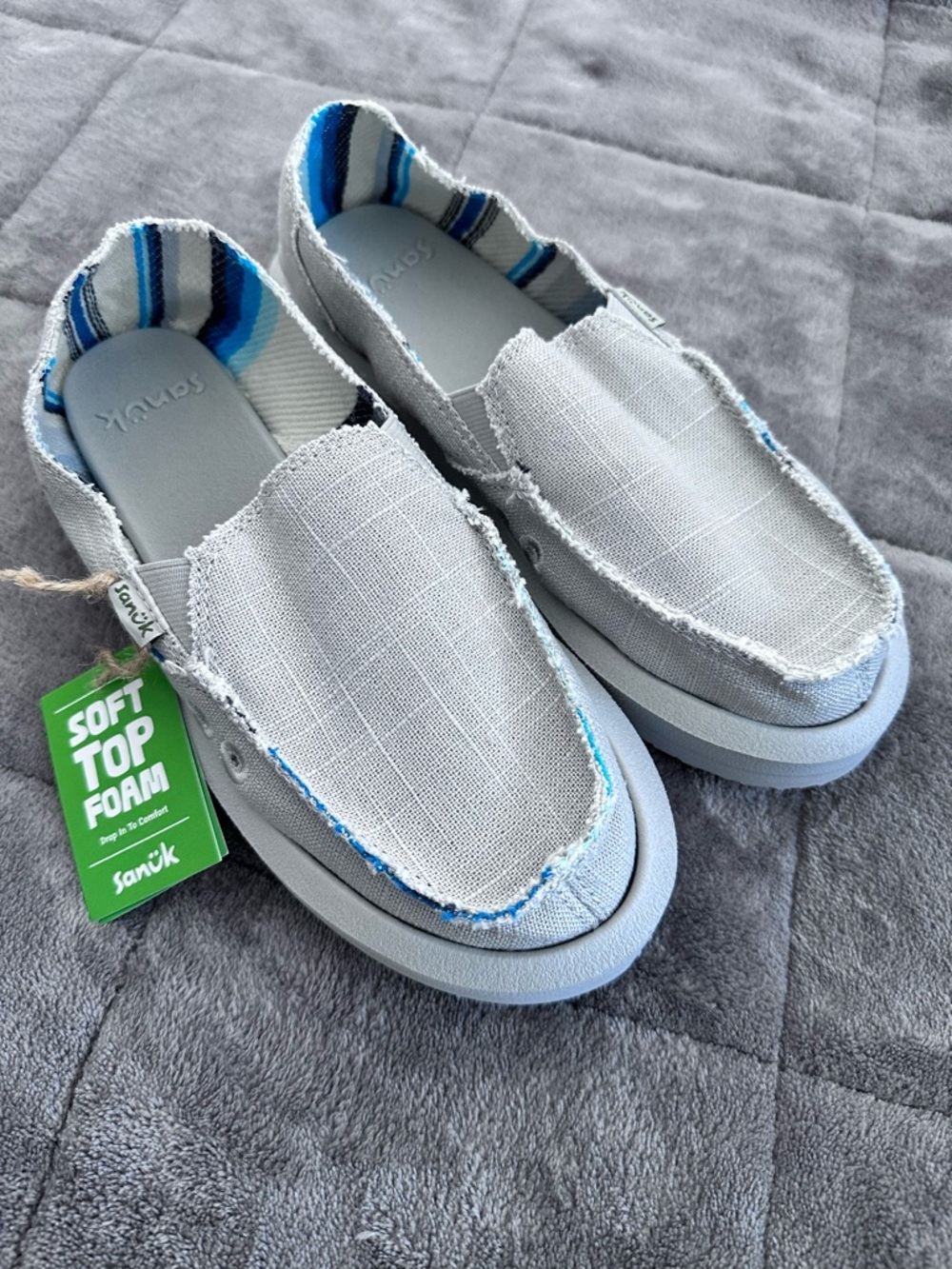 Sanuk Ladies Light Gray Slip-On Sneakers with Blue Stripe Lining